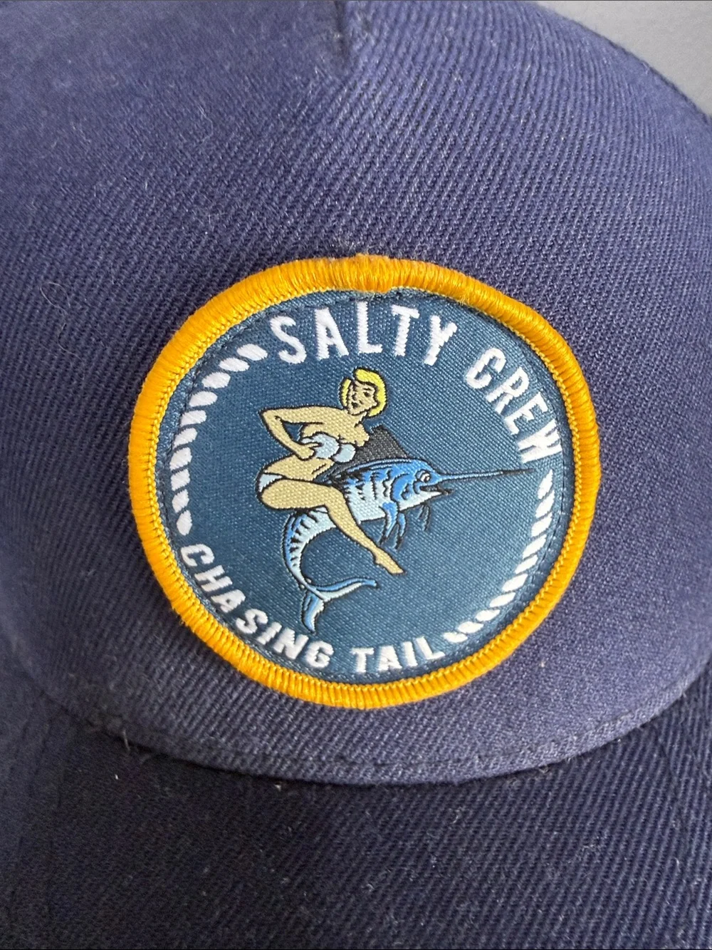 Salty Crew Navy Cap with Yellow-Trim Chasing Tail Patch